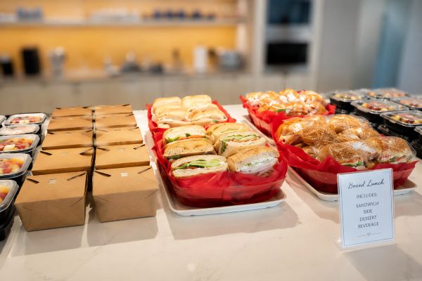 Boxed lunch catering with assorted sandwiches, sides and individually packaged meals